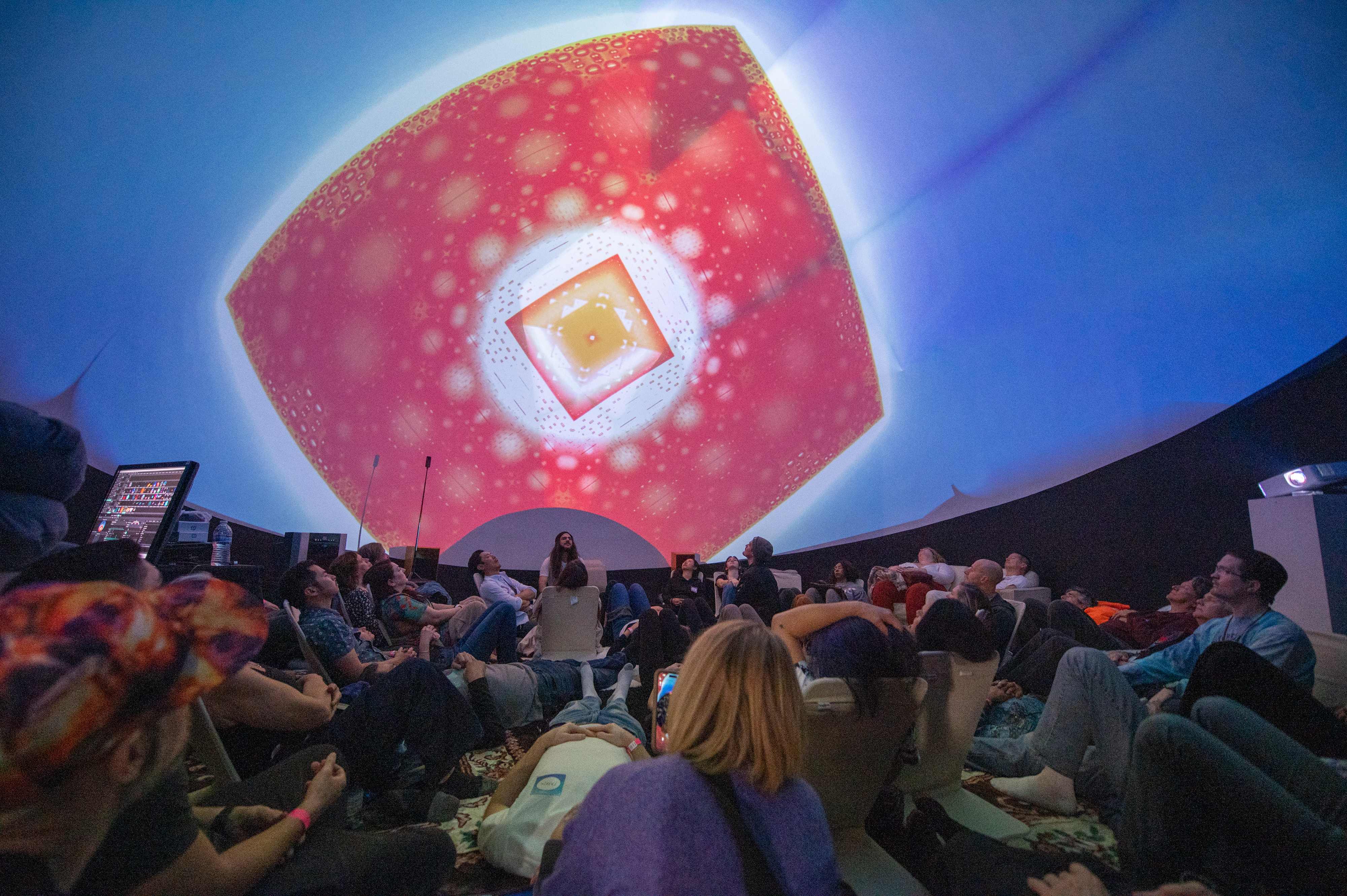 Live mandala projection with packed house