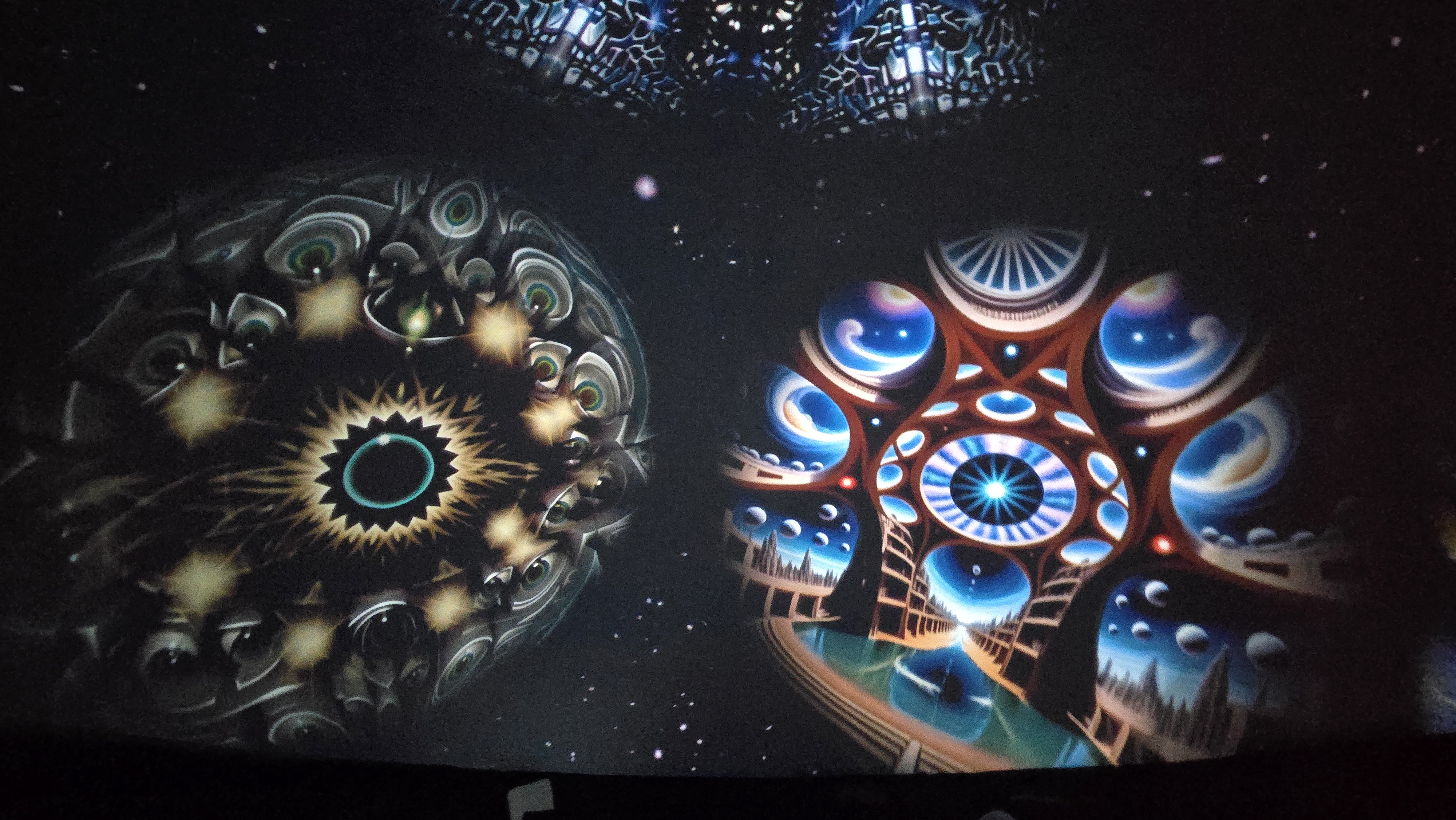 Celestial starburst and temple architecture on dome ceiling